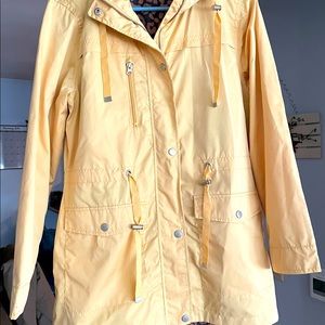 Woman’s yellow rain jacket